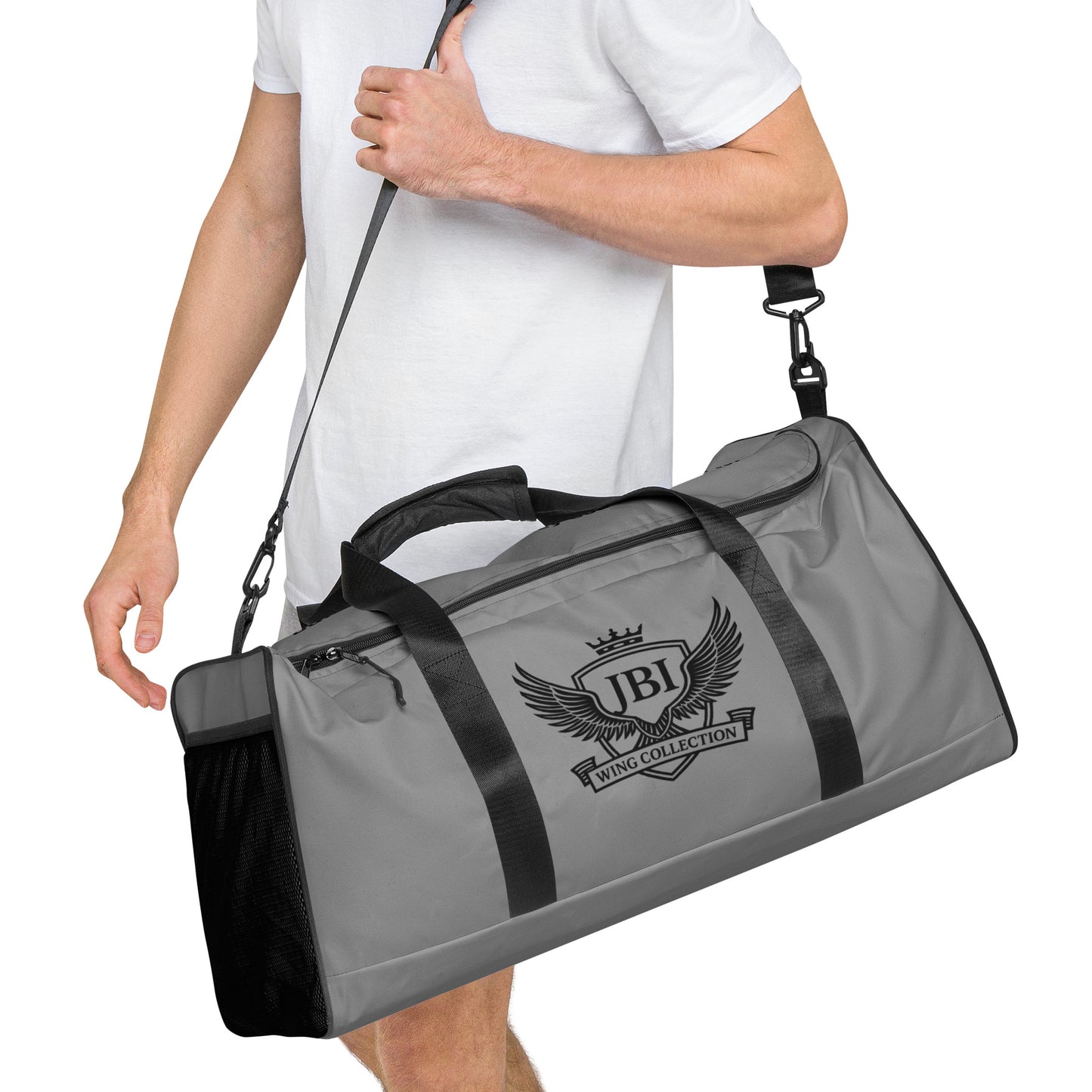 JBI Wing duffle bag gray and black worn over shoulder
