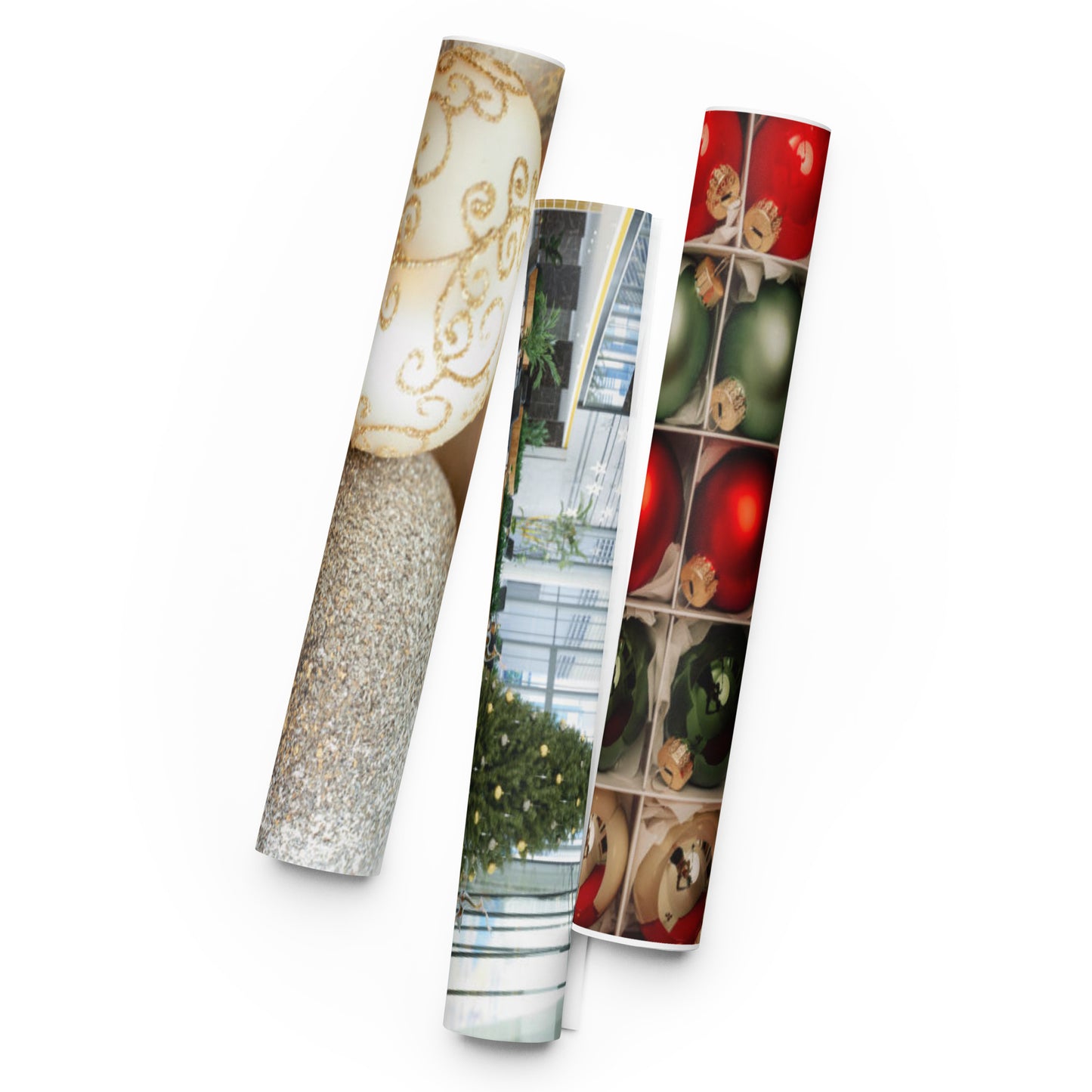 “Three rolled wrapping paper designs — gold, white, and red Christmas patterns — displayed side by side.”