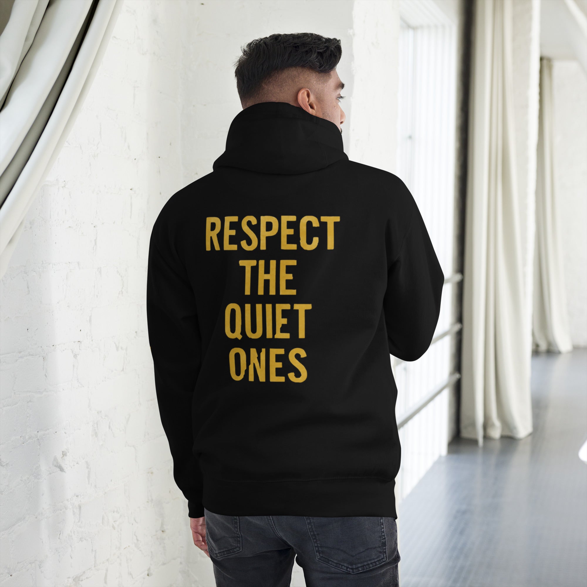 Back view of black Silently Winning Hoodie, sleek premium streetwear with inspirational message style.