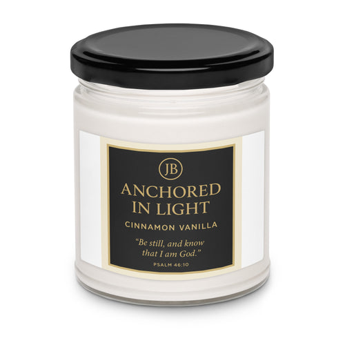 "Cinnamon Vanilla candle with black lid, featuring comforting cinnamon and vanilla fragrance, perfect for relaxation."