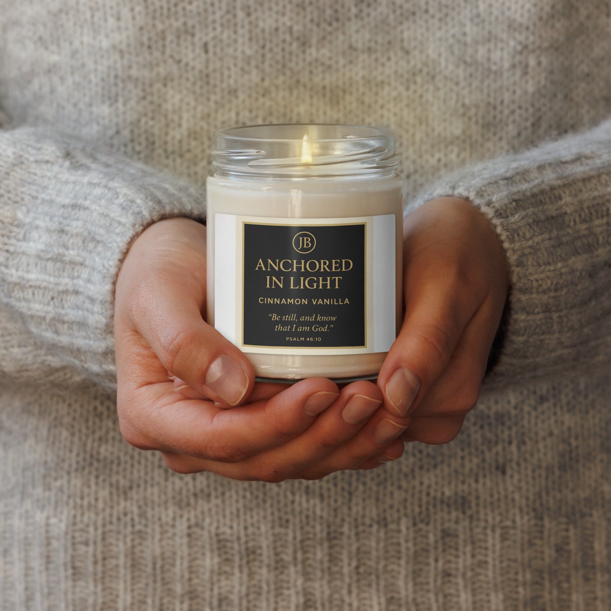  "Cinnamon Vanilla candle with warm and inviting fragrance, held in hands. Scripture Psalm 34:8, cozy home decor."