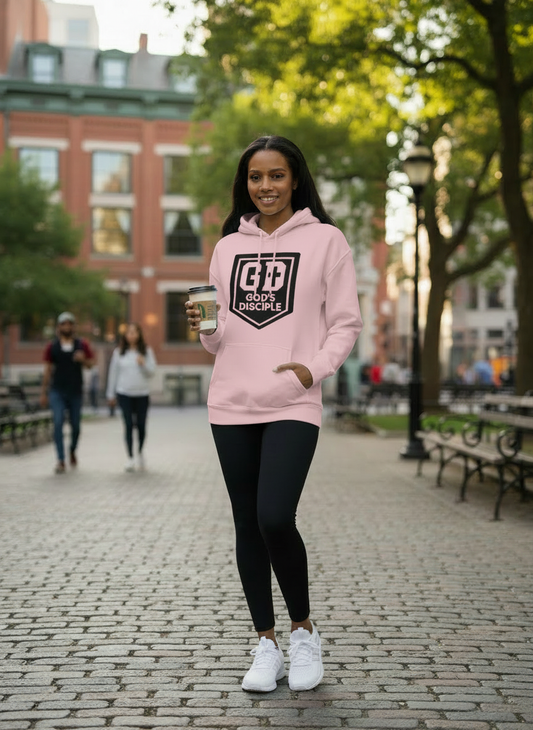 Lifestyle image of woman wearing pink God’s Disciple hoodie outdoors