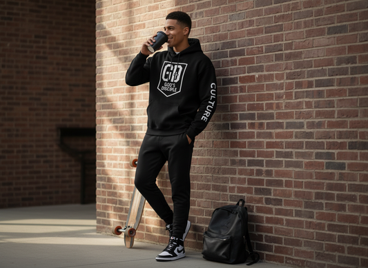 “Man wearing black God’s Disciple hoodie styled in an urban outdoor setting.”
