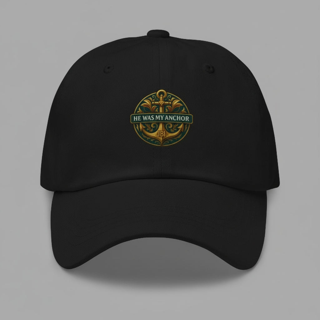 Black dad hat with green and gold "Protected by Grace" emblem.