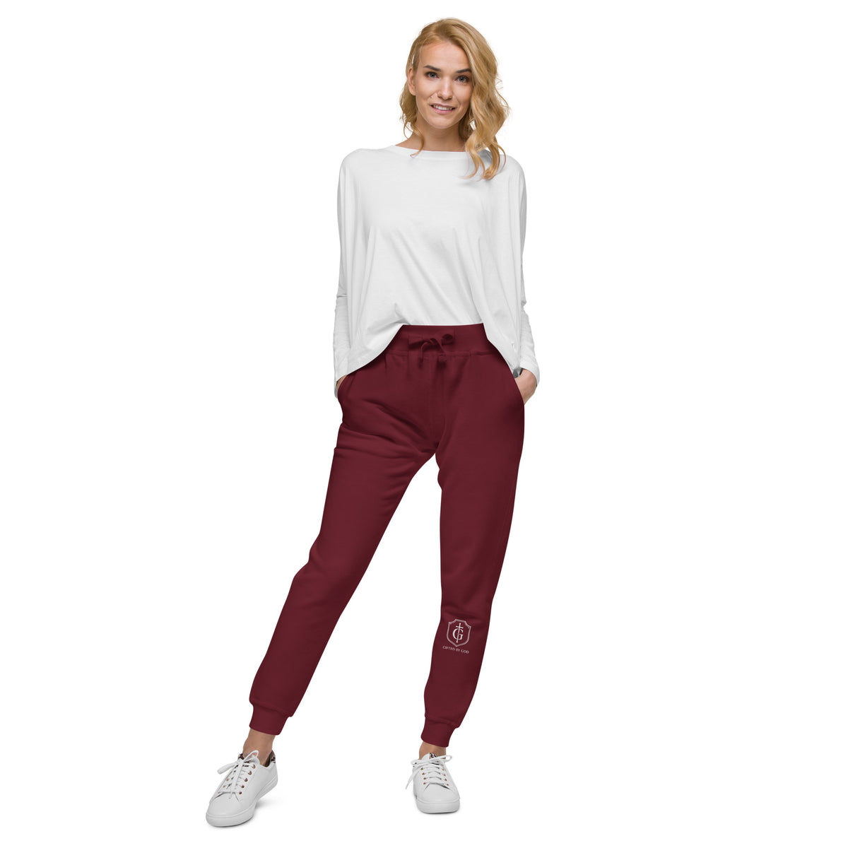 “Front view of maroon Gifted By God joggers with shield and cross embroidery on lower leg, Christian faith-based streetwear.”