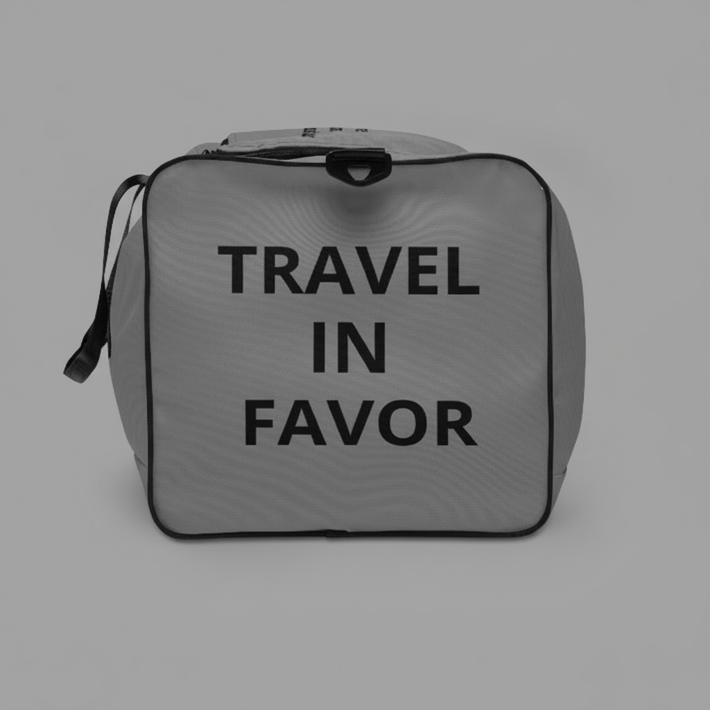 “Side view of the JBI duffle bag with ‘TRAVEL IN FAVOR’ message printed in bold lettering.”
