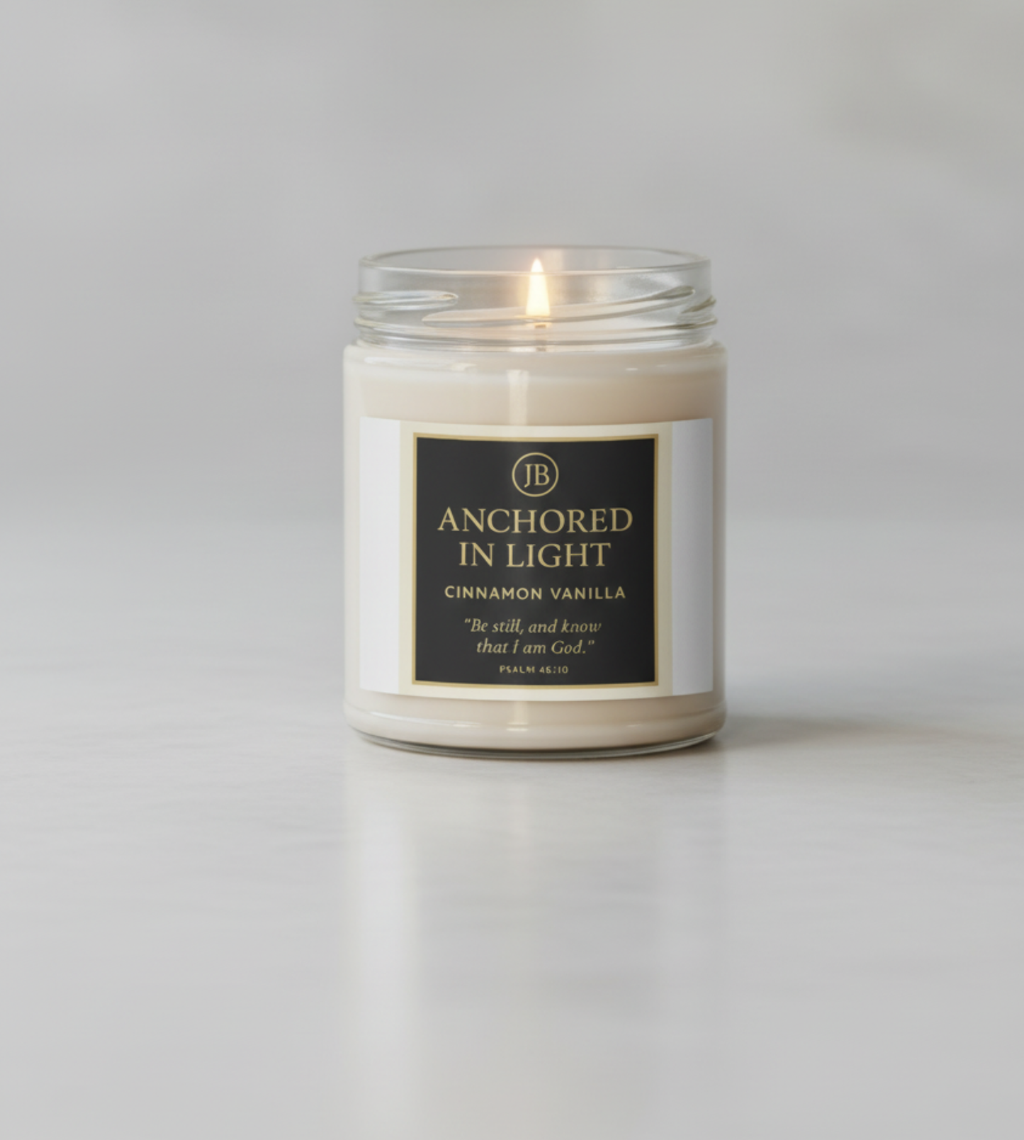 Luxury Anchored in Light coconut vanilla candle on a white background
