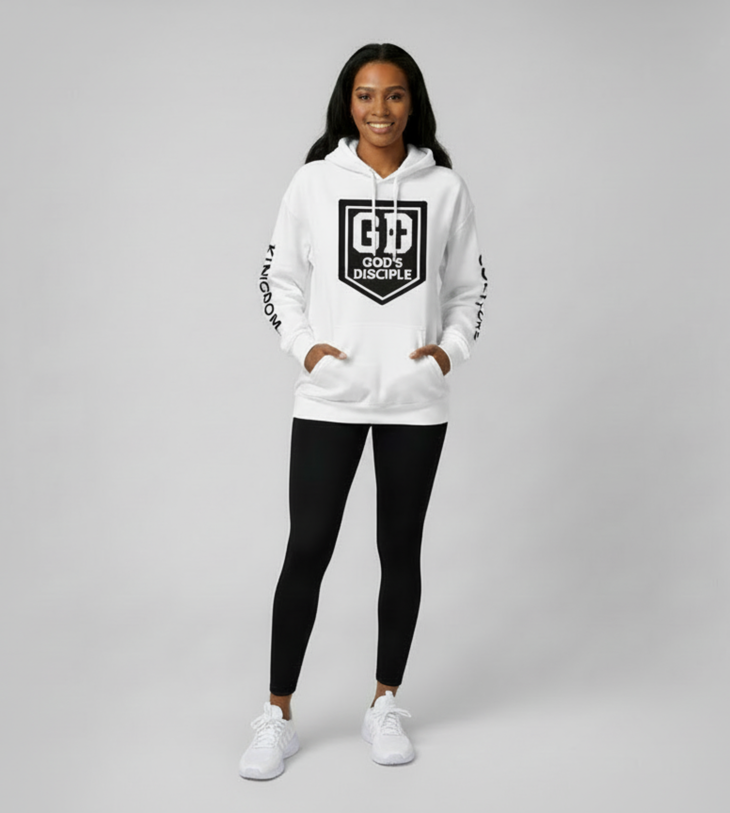 Woman wearing white God’s Disciple hoodie, full-body studio shot