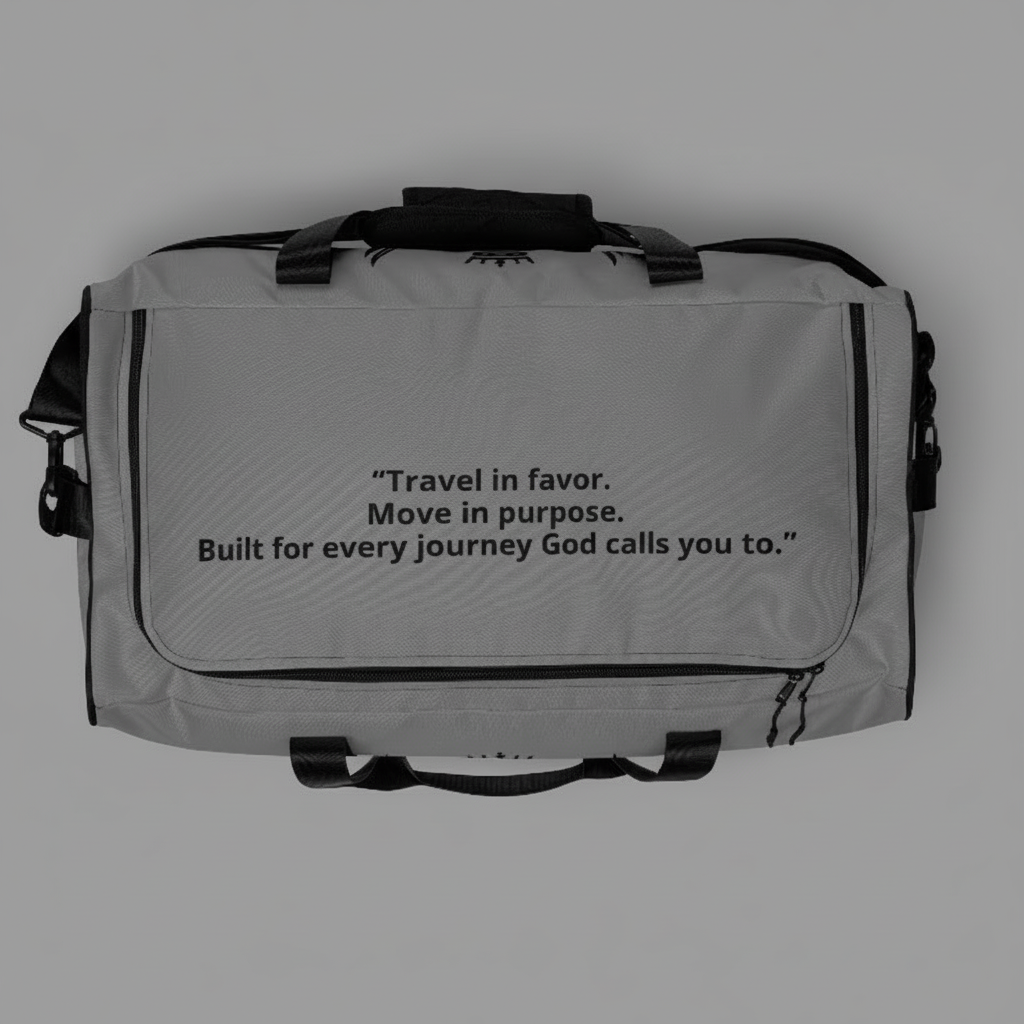 “Underbody view of the JBI duffle bag featuring printed inspirational text and reinforced stitching.”
