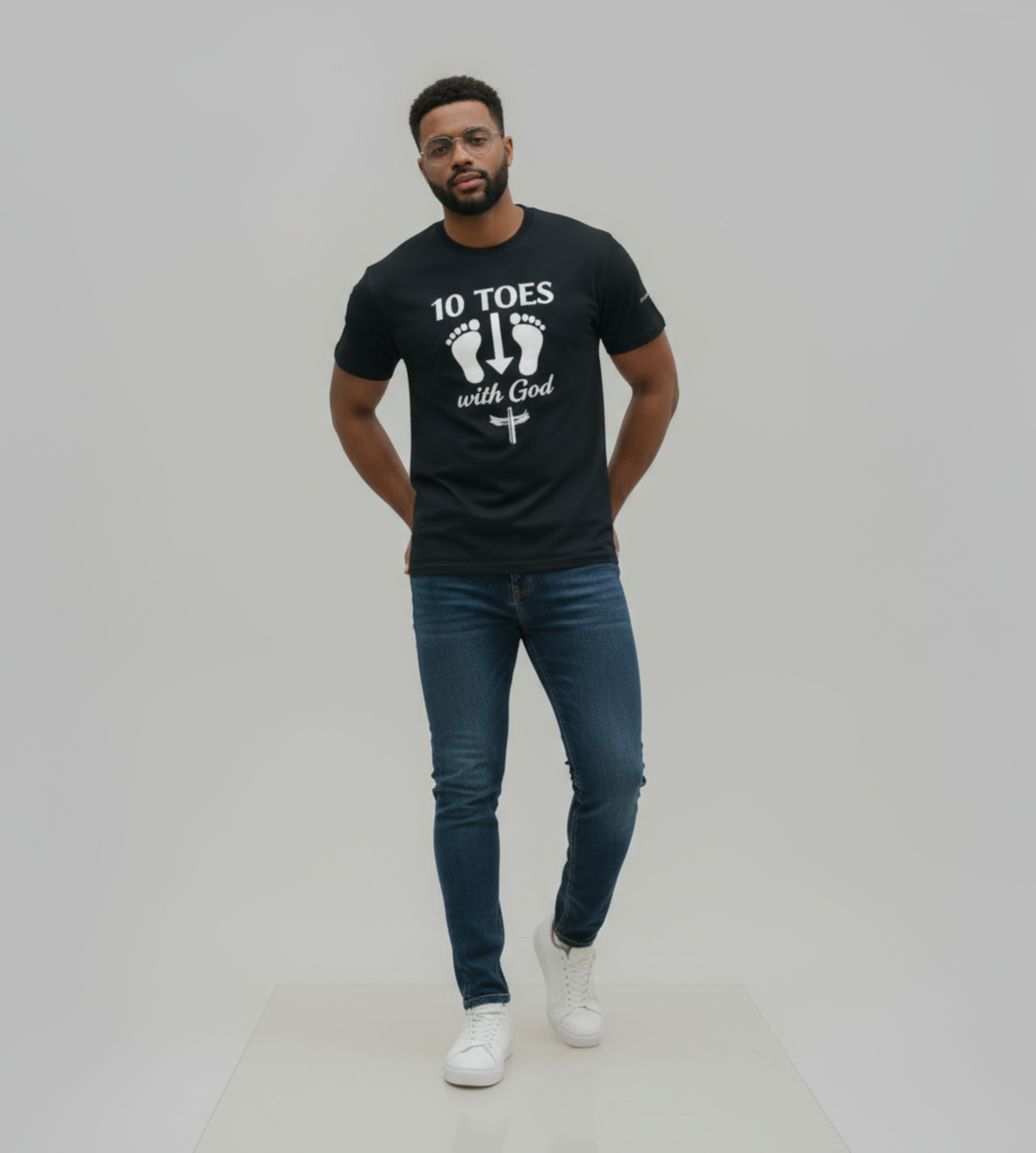 “Man wearing the 10 Toes Down With God black graphic tee, standing in a clean studio setting