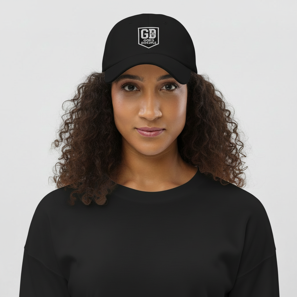 Alt text:
“Woman wearing a black God’s Disciple dad hat with white embroidered GD shield logo.”