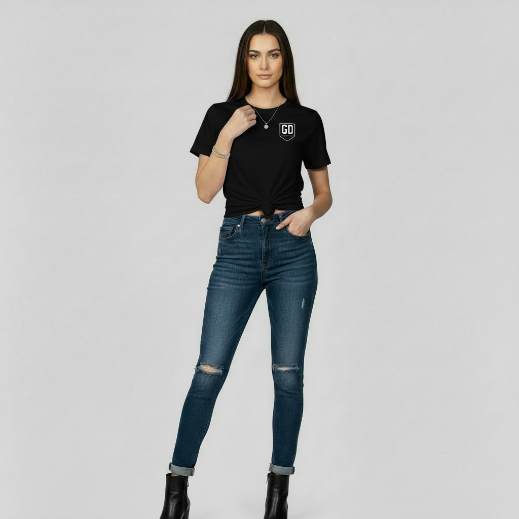 “Woman wearing black JBI fitted tee, front view.”