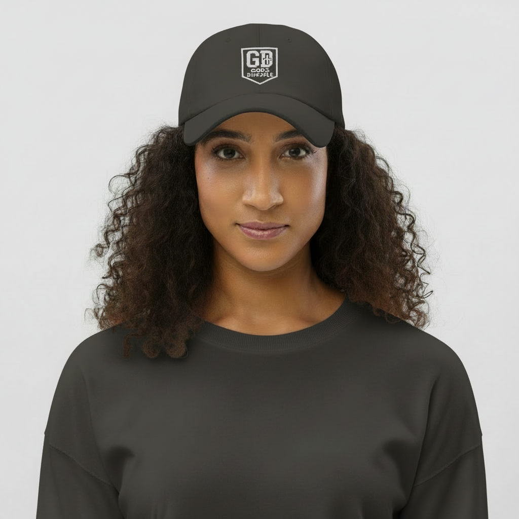 Alt text:
“Woman wearing a dark gray  God’s Disciple dad hat with white embroidered GD shield logo.”