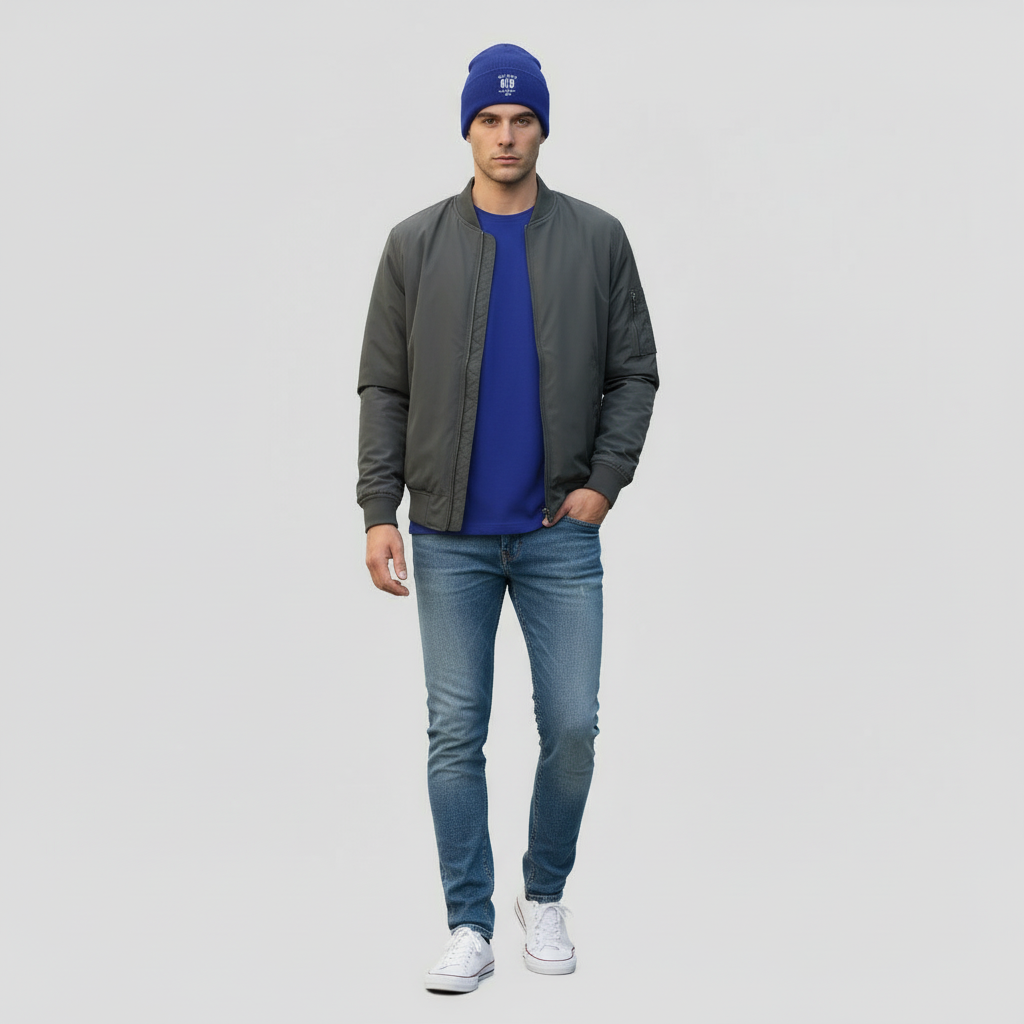 “Man wearing the blue 10 Toes Down beanie during winter, styled with a jacket and jeans.”