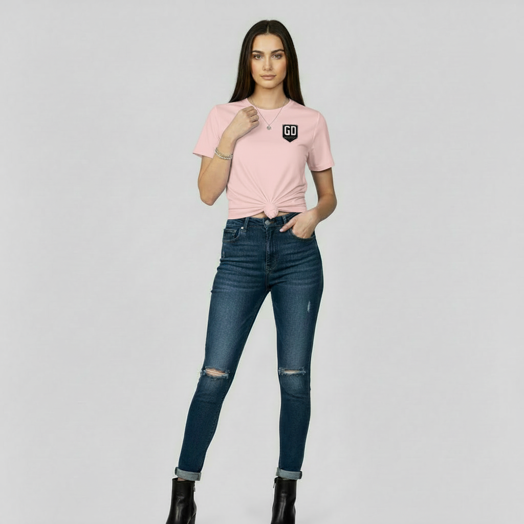 “Woman wearing pink JBI fitted tee, front view.”