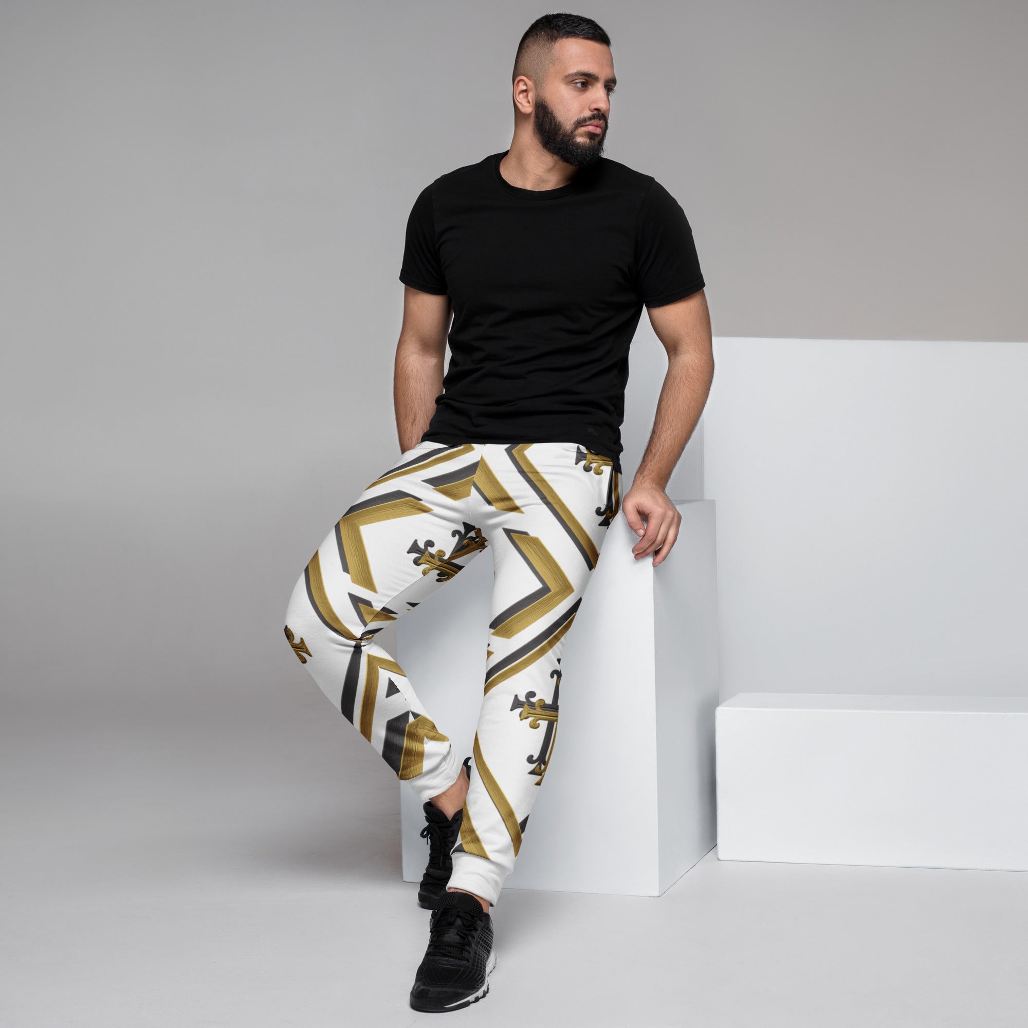 “Kingdom Luxe luxury joggers, front view in white with gold and black cross pattern, premium Christian streetwear.”