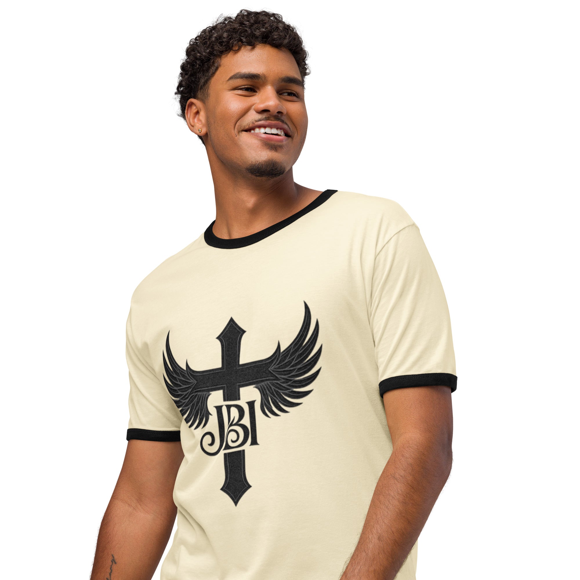 “Natural with Black trim JBI Wings Emblem Tee featuring bold cross-and-wings emblem.”