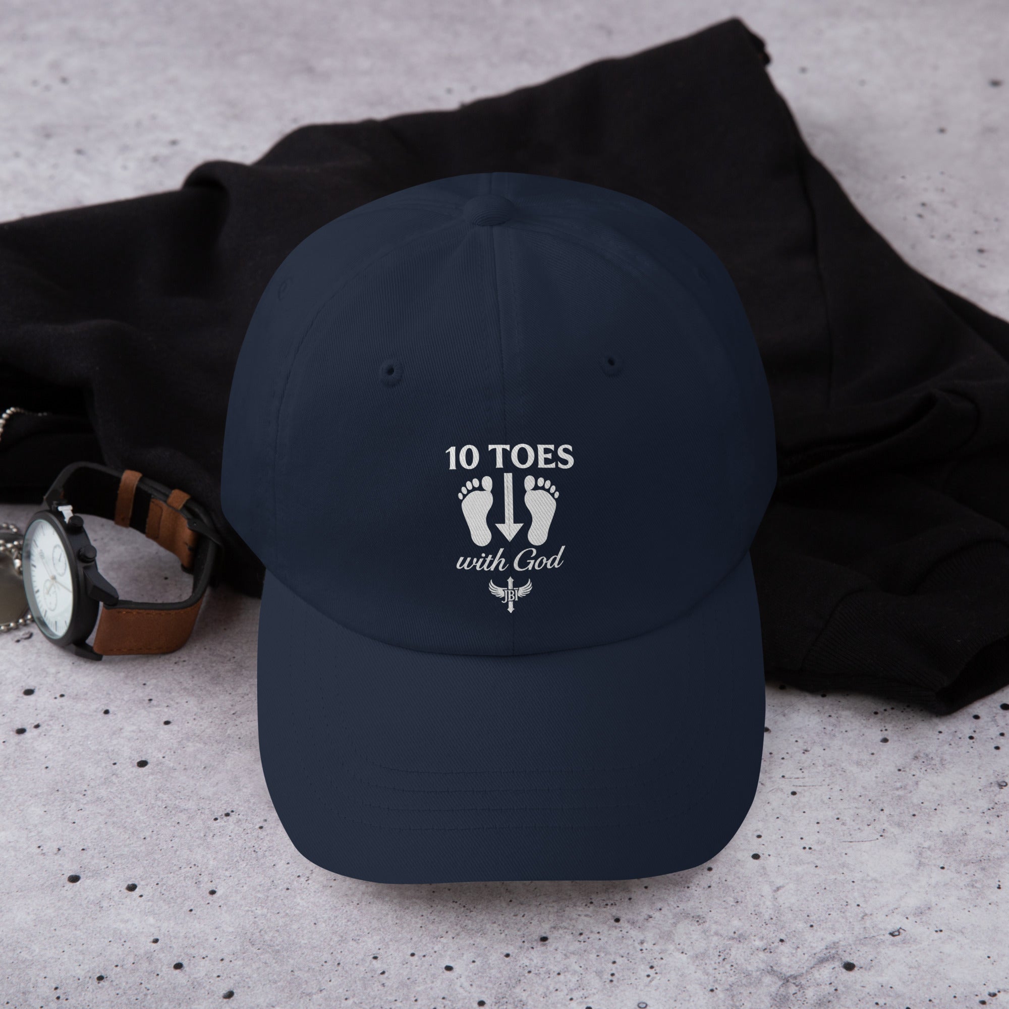 "Navy baseball cap with white 10 Toes Down emblem featuring two feet and the words '10 Toes Down' beneath."