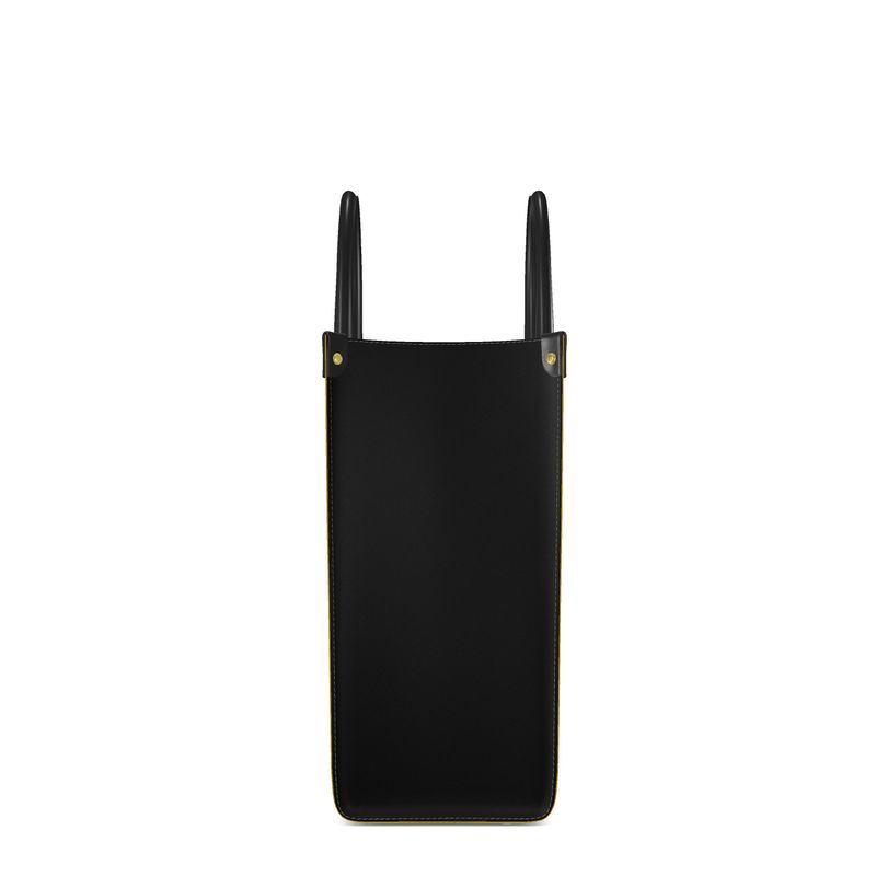 "Side view of luxury mustard yellow shopper bag with sleek black side panels and structured design, accented by two black corner squares at the top for a sophisticated, high-end look."