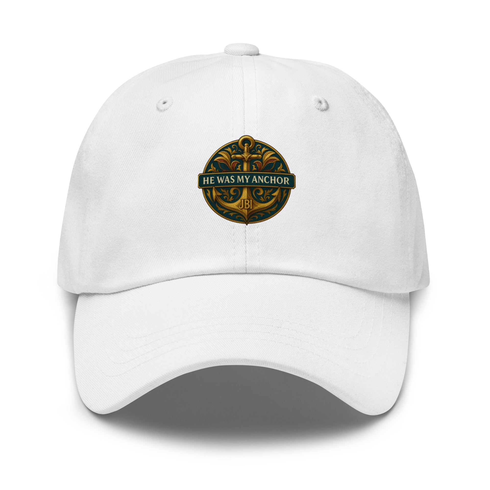 "White baseball cap featuring a gold He Was My Anchor emblem on the front."