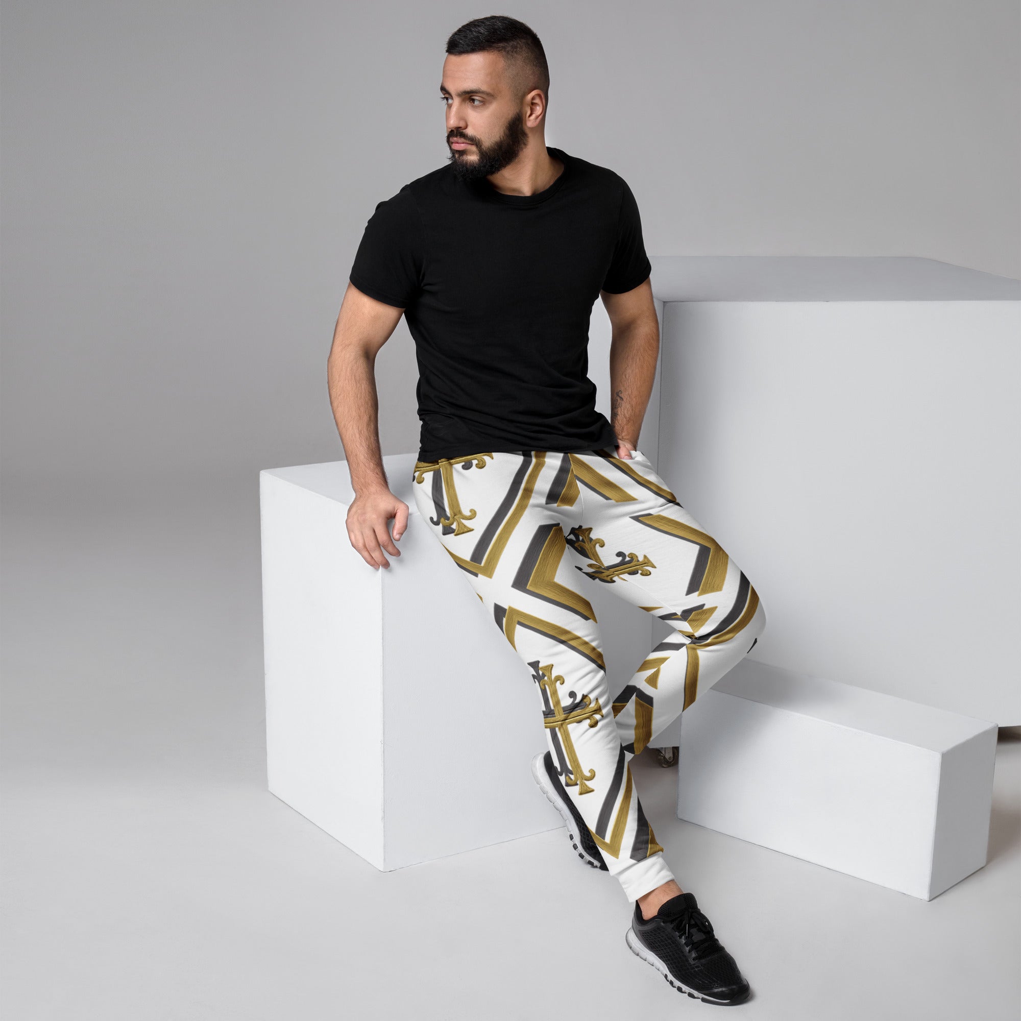 “Side view of Kingdom Luxe joggers white with bold gold and black cross pattern, luxury faith-based streetwear.”